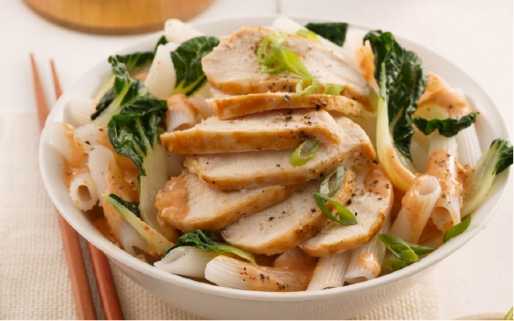 Rice noodles and chicken with lime and baby bok choy